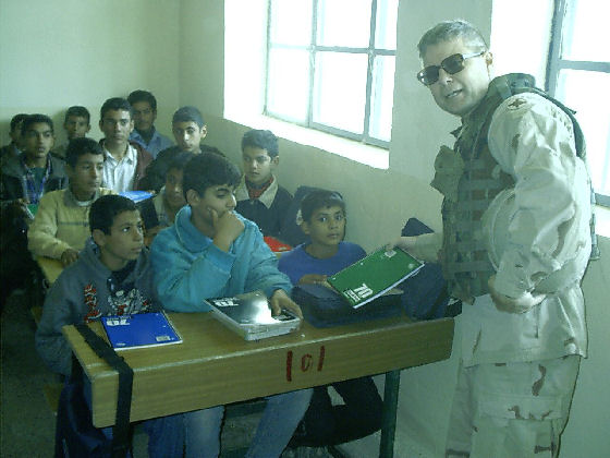 Don handing out supplies to children at a school near the Balad Airbase where he was stationed. Balad, which is about 50 miles north of Baghdad, has been described as ground-zero for Baath Party (the political party of Saddam Hussein) sentiment.